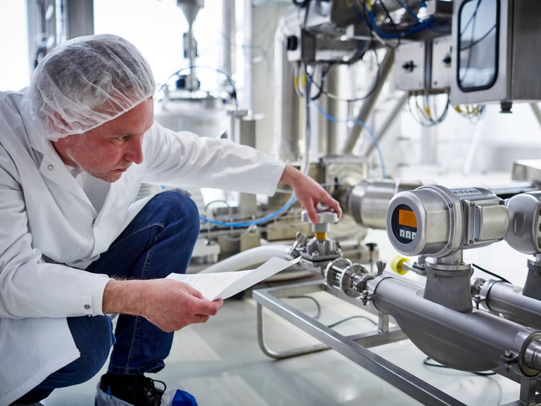 Experienced service technician calibrating a flow device
